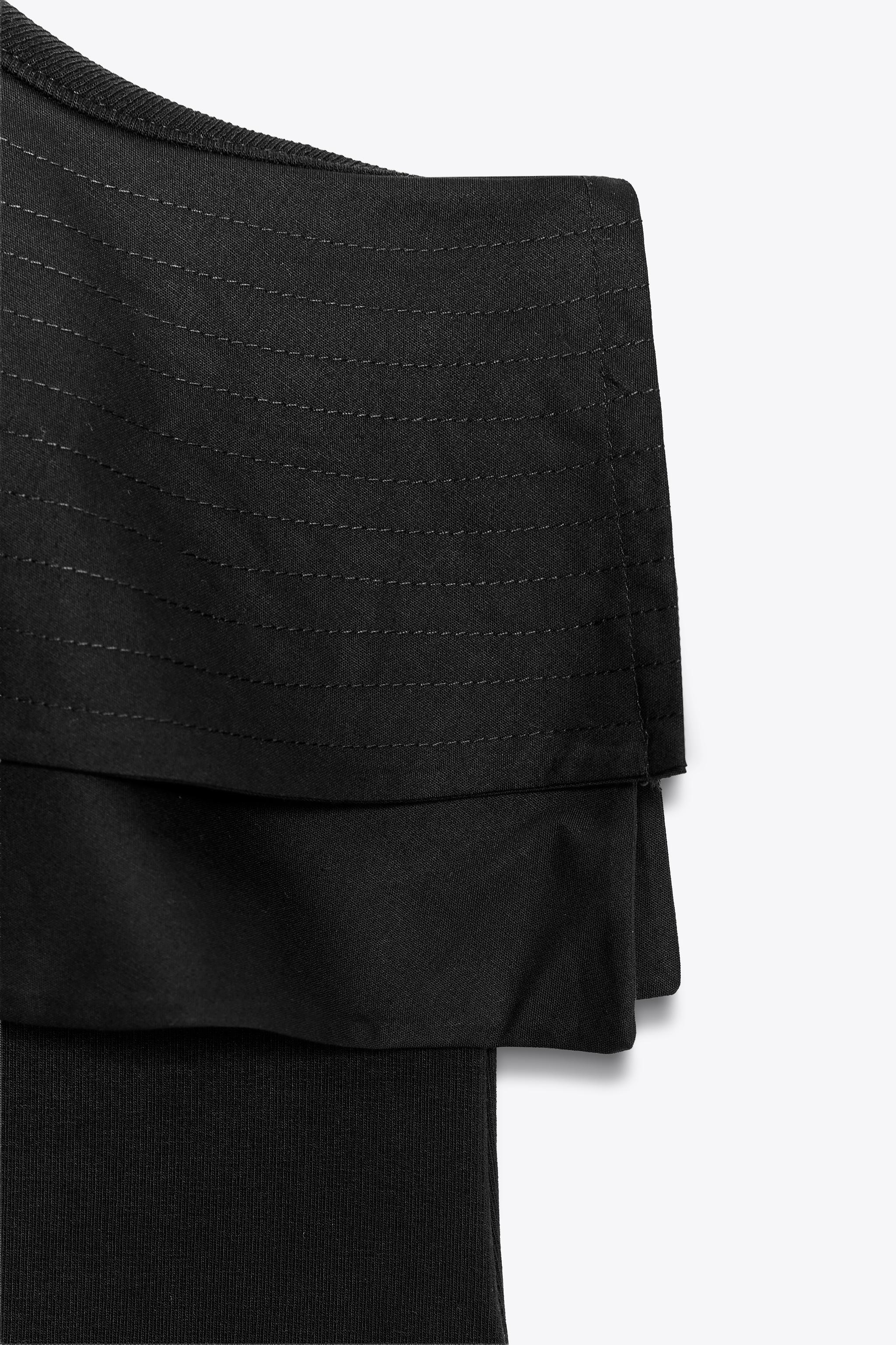 ASYMMETRIC BODYSUIT WITH CONTRASTING RUFFLE